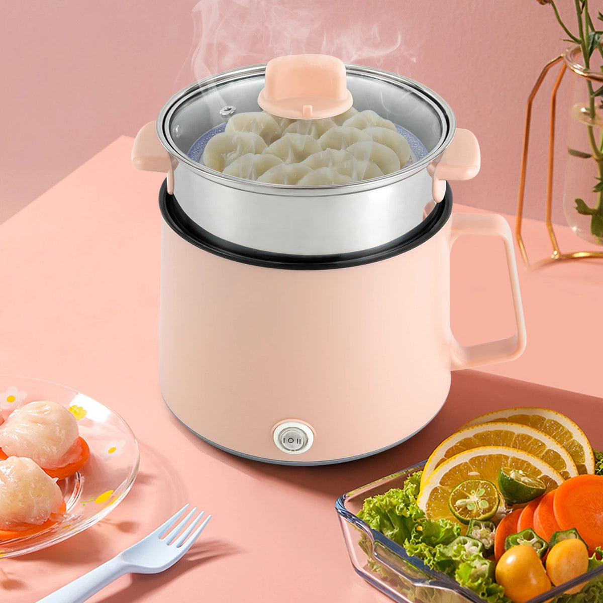 Mini cuiseur à riz rose avec étage vapeur et raviolis