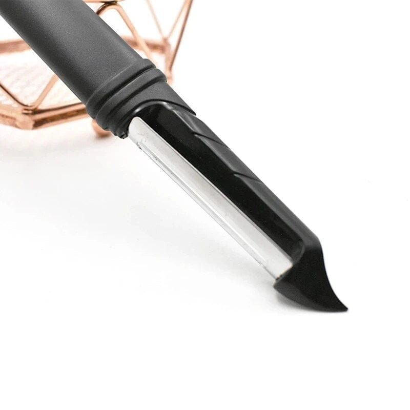 Économe à lame dentelée pivotante