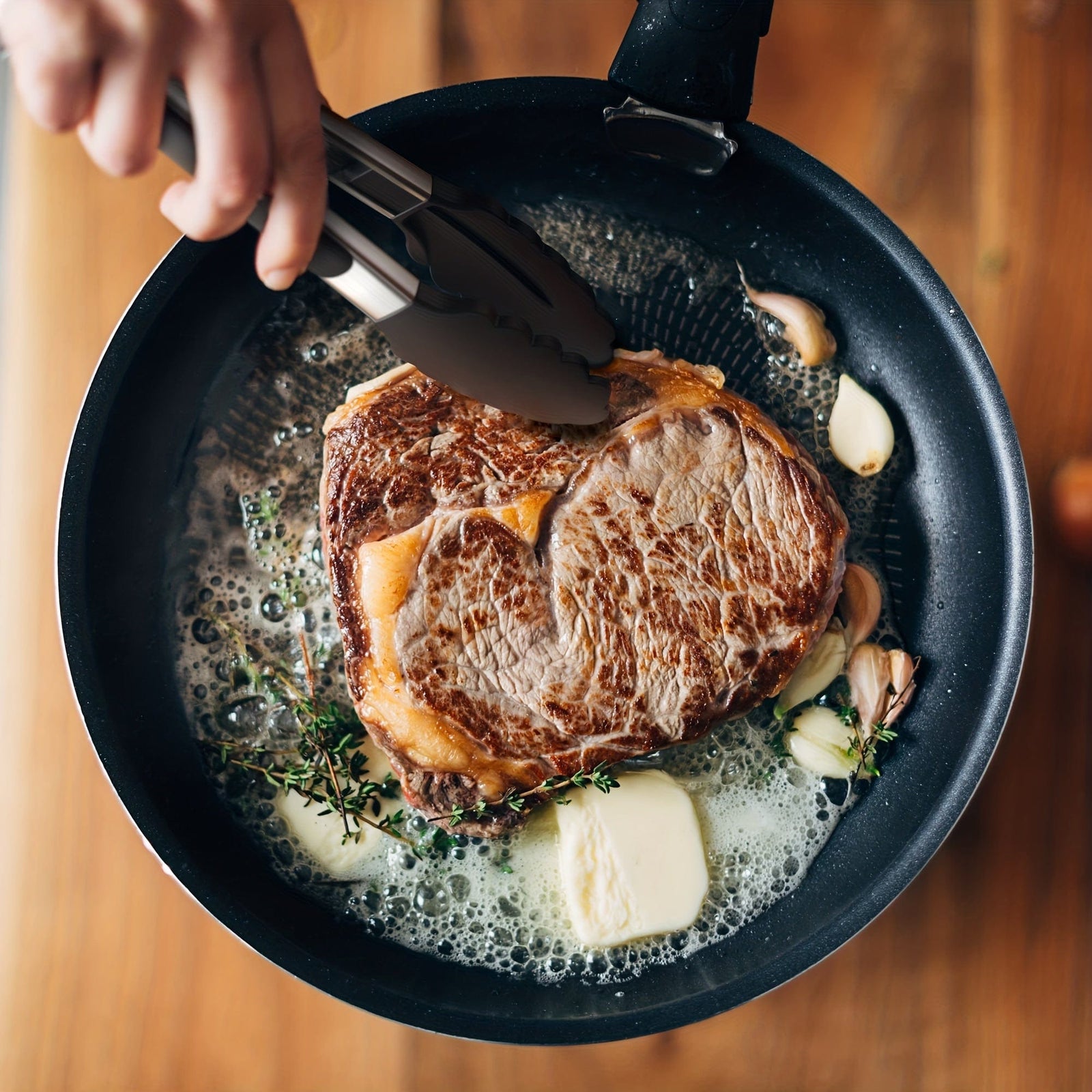 Tong de cuisine en acier inoxydable avec embouts en silicone noirs