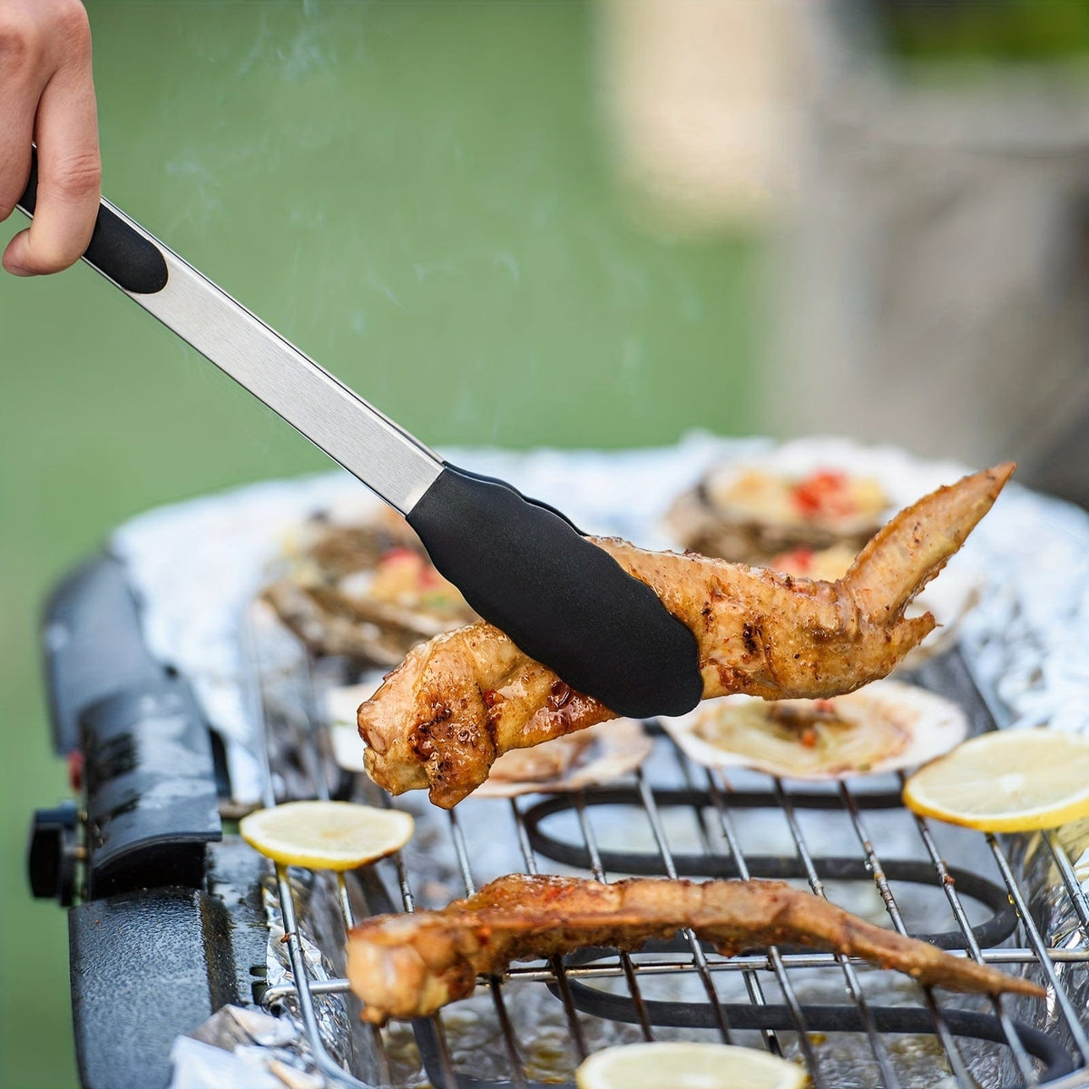 Tong de cuisine en acier inoxydable avec embouts en silicone noirs